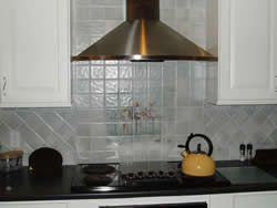 Wall mount kitchen range hood with ceramic tile backsplach