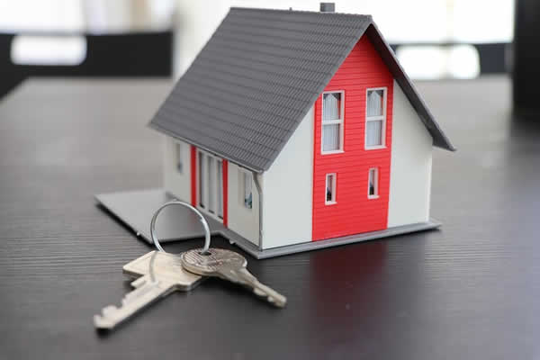 small house with set of keys