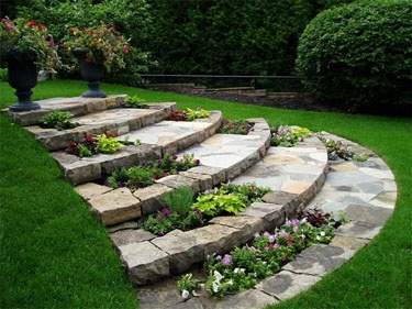 Curved stone steps double as plant beds