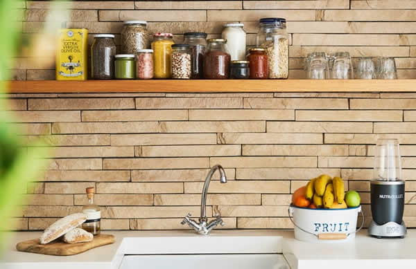 spices in containers on shelf over kitchen sink