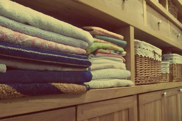 towels neatly stacked on a shelf