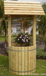 full size wishing well provides a place for a planter