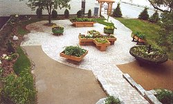 A picturesque accessible garden. It uses a variety of shapes to construct correctly sized raised planters