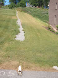 French drain used to control the direction of water run-off from on a hill.