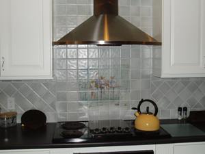 ceramic tile backsplash over cooktop