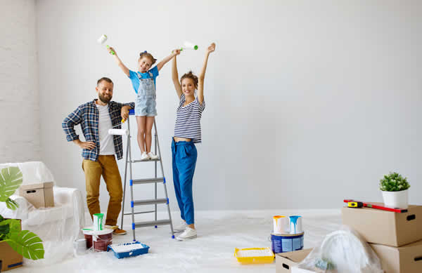 family painting a room