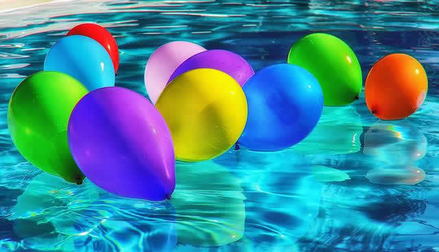 colored ballons on water