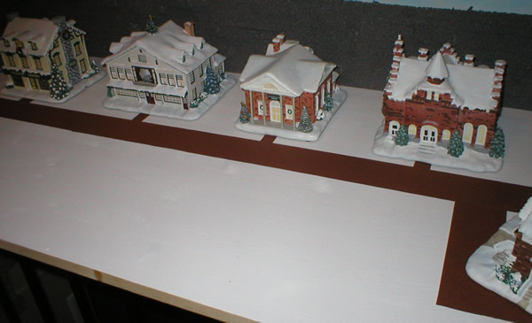 Christmas village buildings positioned from front right