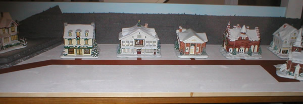 Christmas village buildings positioned from front
