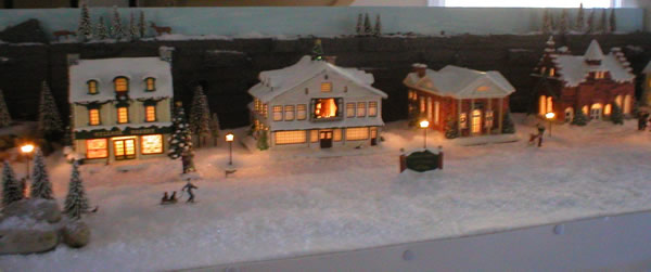 Christmas village finished shows bakery, studio, bank and city hall