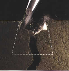 chisel expanding crack in concrete slab for repair