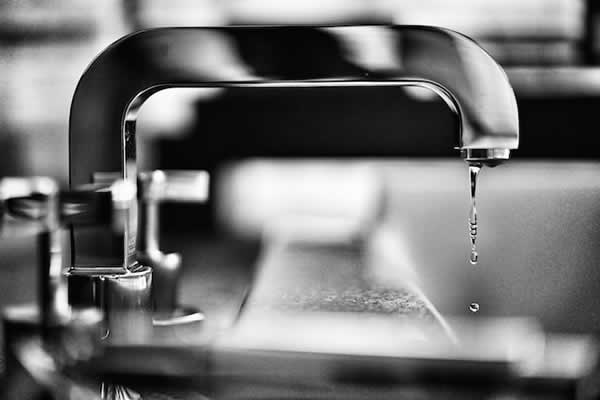 modern faucet dripping water