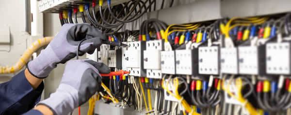 electrician working on an electrical panel