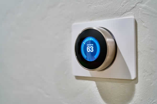 electronic thermostat mounted on wall