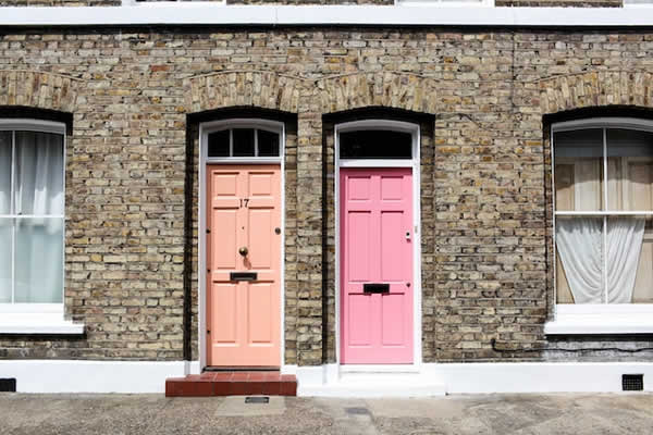 Two front doors on brick row houses