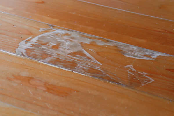 white paint on a hardwood floor