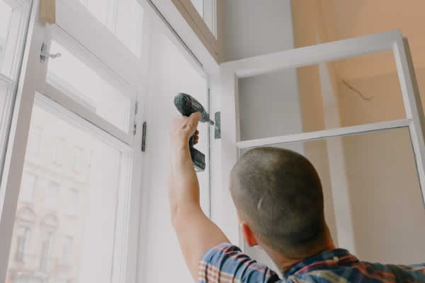 man installing a window