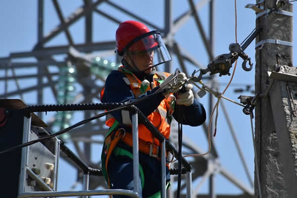lineman working on high voltage cables