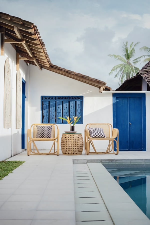 outdoor furniture by a swimming pool