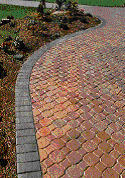 Grey and red paving bricks used to create a driveway