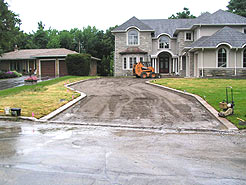 Driveway foundation being graded