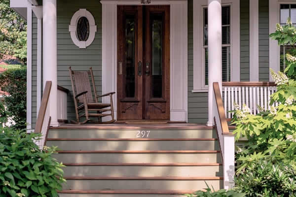 picture of front doors on older home with porch