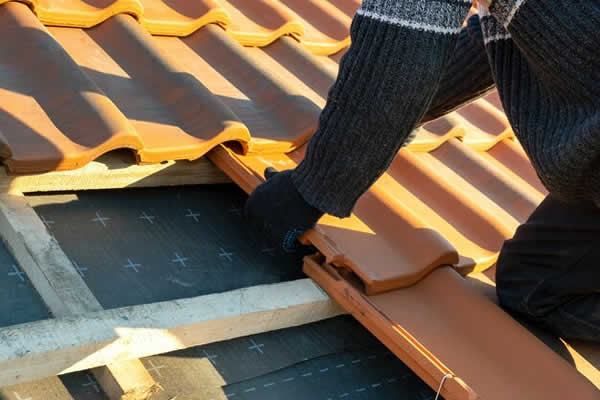 roof tiles being installed on a roof