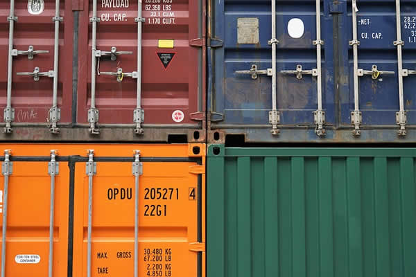 4 different colored shipping containers