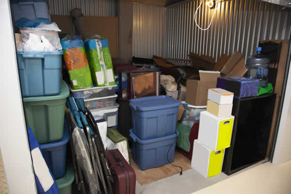 storage facility with door open filled with a lot of household items