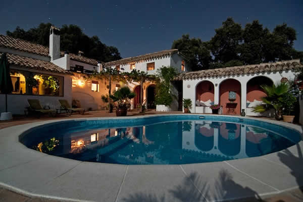 swimming pool in the backyard of Spanish style home