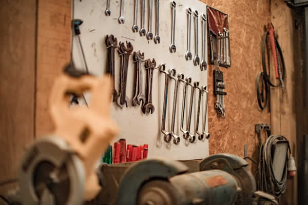 wall display of wrenches in a garage