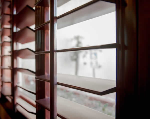 brown window shutters in the open position