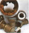 Pipes and valves clogged with mineral deposits