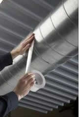 Wrapping an air duct with aluminum foil tape