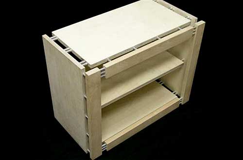 Cabinet with a face-frame covering edges of side and top panels