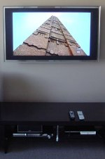Wall mount flat screen TV with no wires showing.