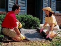 Landscape fabric being unrolled.