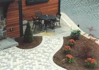Paving bricks used as a walkway, patio and defines plantings