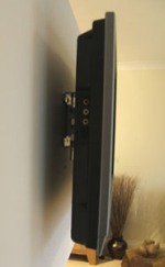 Flat panel mounting bracket has TV protruding from the wall.