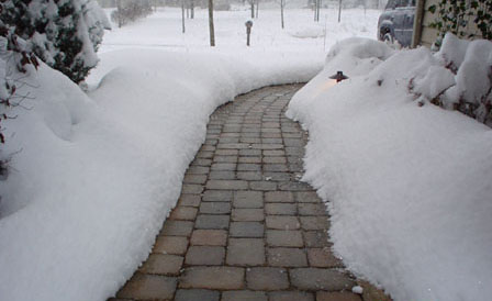 walkway with melted snow where radiant heating has been installed