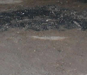 gas spill on asphalt