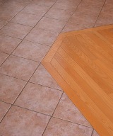 hardwood floor inset in a ceramic tile floor