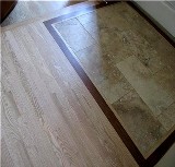 Natural stone inset in a hardwood floor