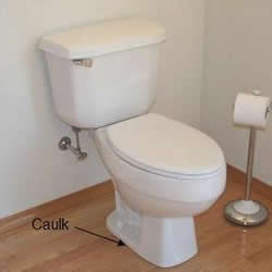 caulked toilet base
