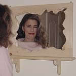 scroll framed mirror with shelf