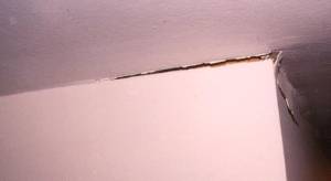 ceiling and wall damage caused by roof truss uplift